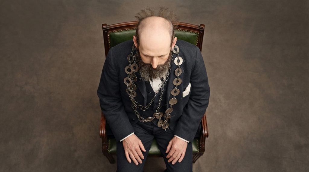 Man_sitting_in_chair_202607240028