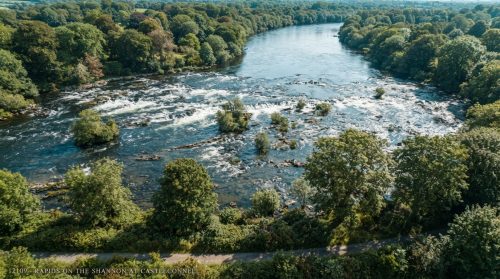 River_rapids_lush_forest_aerial_202607240040