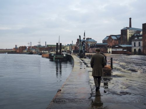 Dockworker_walking_along_stone_quay_202608161023